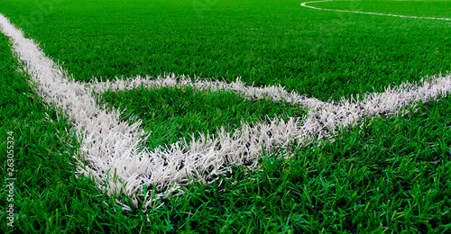 Artificial turf soccer field with corner marker line.