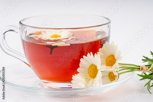 cup of tea with chamomile flowers