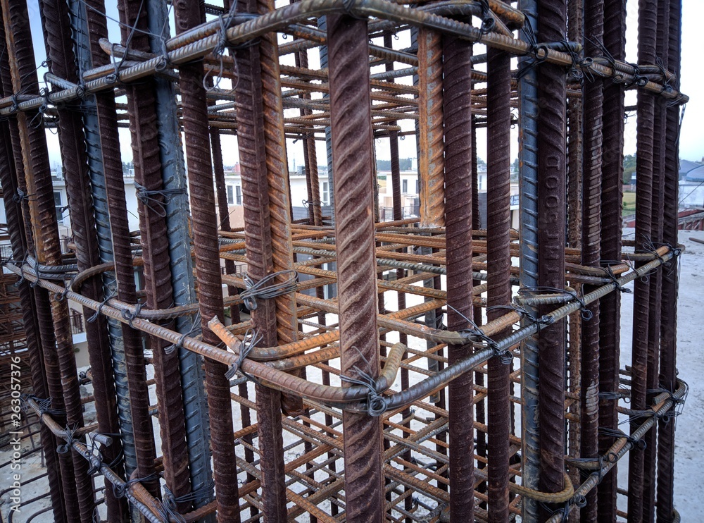 reinforcement of column provided with steel wires by workers
