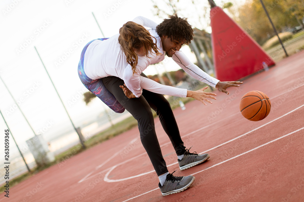 Couple playing basketball Stock Photo | Adobe Stock