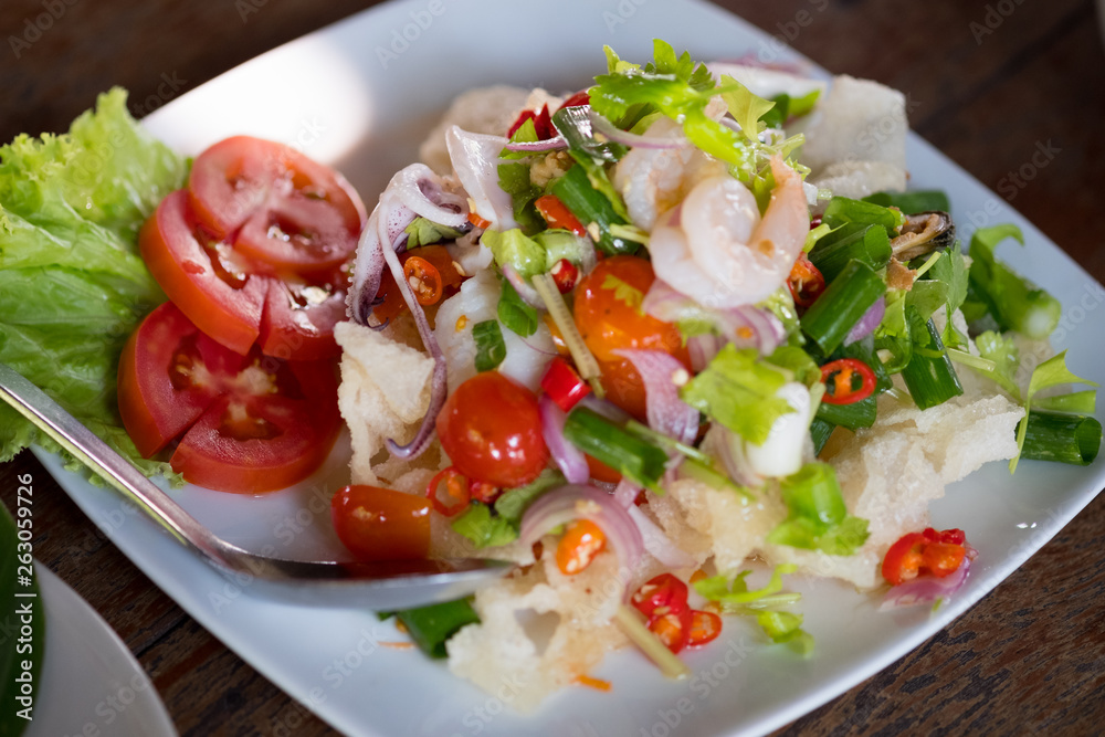 Spicy salad seafood with squid shrimp salad
