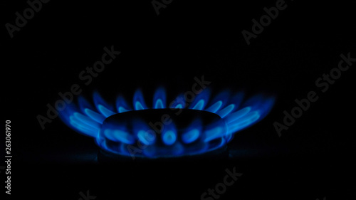 blue flames of gas burning in the dark