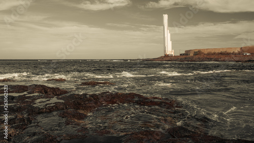 Lighthouse on the coast in black and white