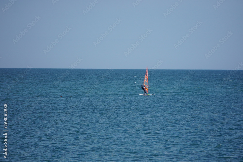 Naklejka premium windsurfing on sea