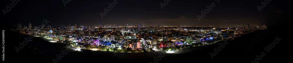 Aerial night panorama of Miami Beach Ocean Drive at night