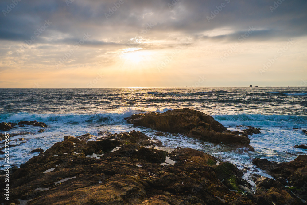 Ocean scenery with powerful waves at sunset
