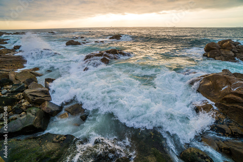 Ocean scenery with powerful waves at sunset