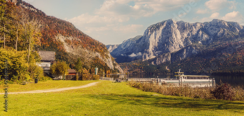 Awesome Alpine Landscape. Austrian Village with Roky Mountain on Background, incredible Autumn Scenery. Amazing Natural View. Salzkammergut's Mountains. Austria. Europe. Instagram Filter.