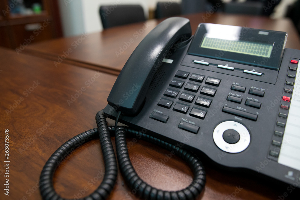 close up soft focus on telephone devices at office desk with light effect,communication technology concept close up soft focus on telephone devices at office desk with light effect,communication technology concept