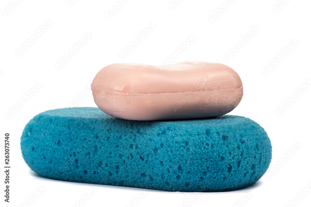 Soap and blue washcloth on a white background