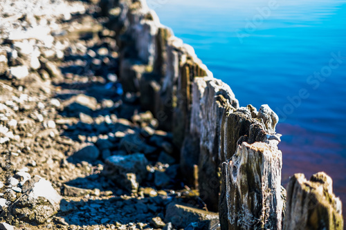 Old historical river reinforcement isolated with a blurred background