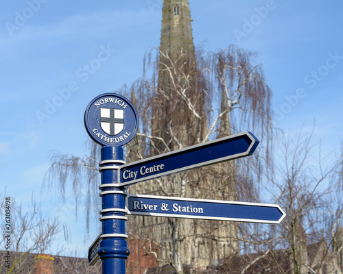 Norwich Cathedral Signpost, Tourist Information with Cathedral Tower in Background