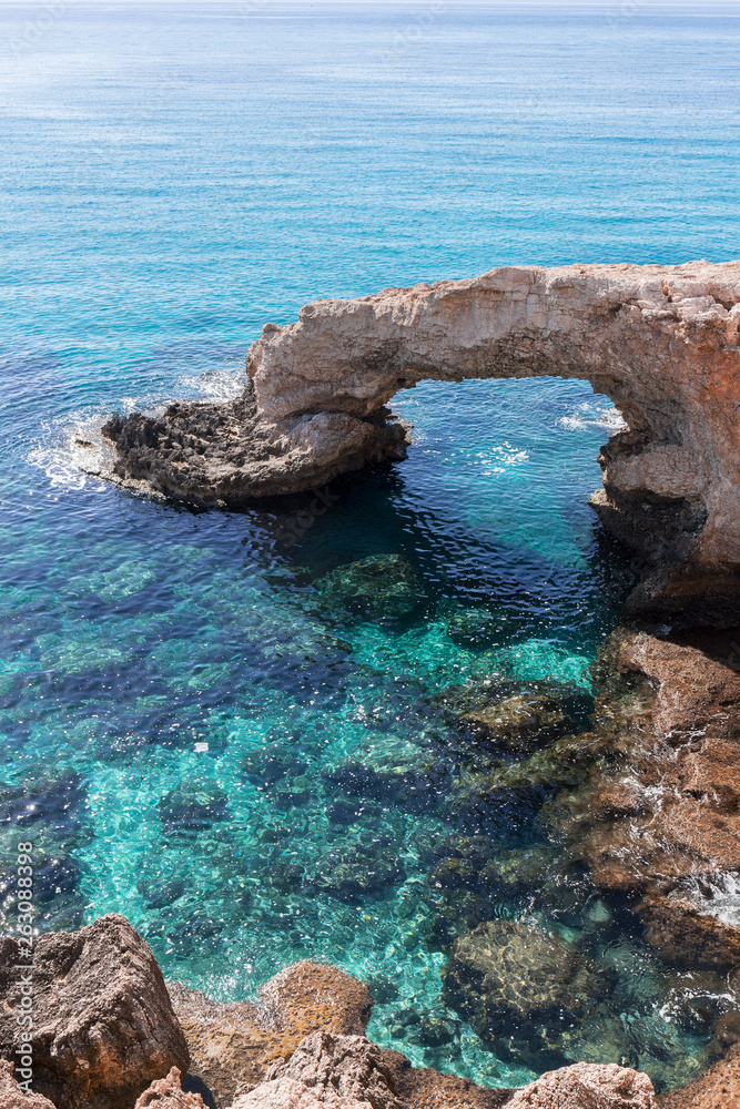 Rock arch with the name of Love Bridge at the coast of in Ayia Napa, Cyprus.