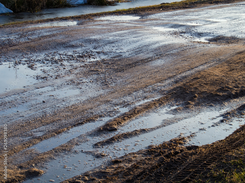 dirty rural road with deep tire tracks dirty rural road with deep tire tracks