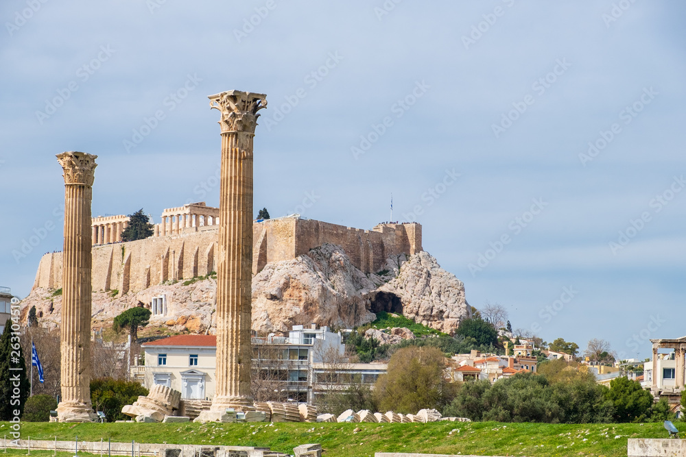 Ruins of the ancient Temple of Olympian Zeus in Athens with Acropolis hill in the background