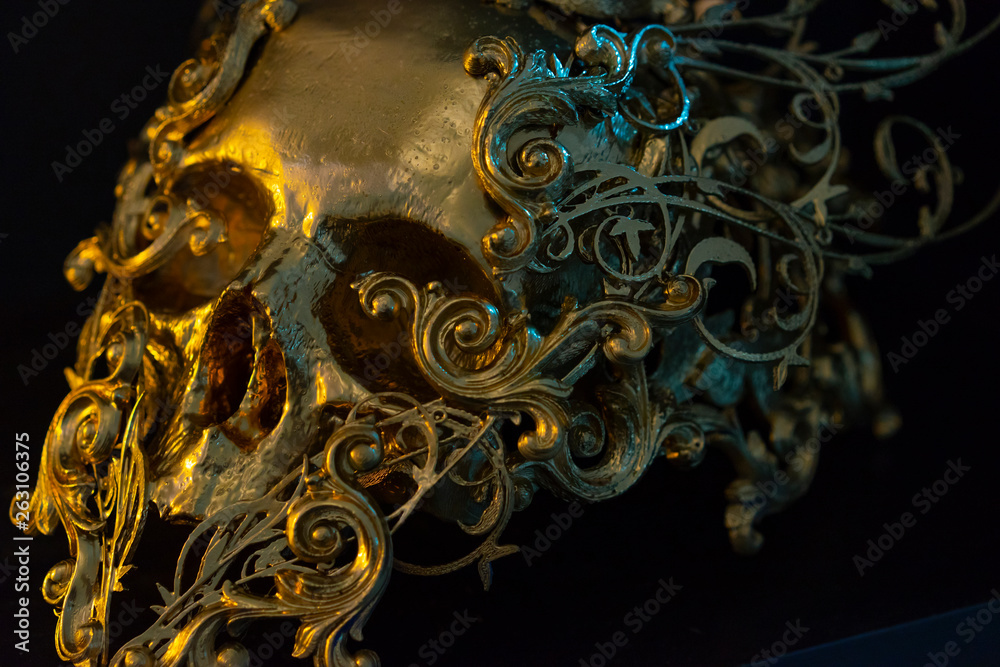 Fear, golden skull made with 3d printer and pieces by hand. Gothic piece of decoration for halloween or horror scenes
