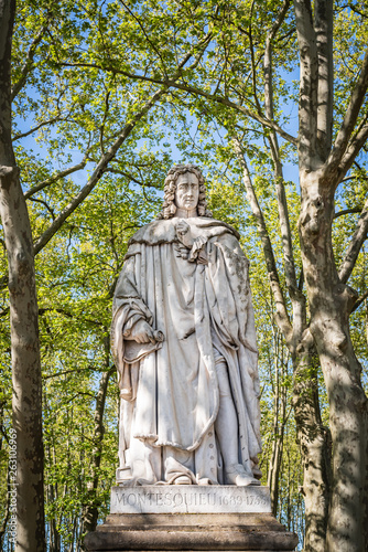 Statue of Montesquieu 1689-1755 in the park of quinconces - Bordeaux, France photo