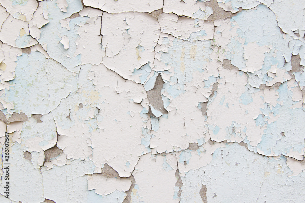 Old cement wall with cracked blue paint texture Old cement wall with cracked blue paint texture