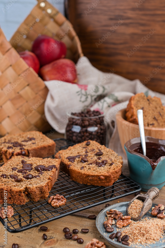 Cake with cocoa and chocolate on a wooden table. Sweet homemade pastries for breakfast. Rustic style photo. Cake with cocoa and chocolate on a wooden table. Sweet homemade pastries for breakfast. Rustic style photo.