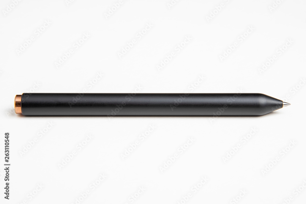 A close-up studio product shot of a modern matte finish black barrel clicker ballpoint pen set on a plain white background. A close-up studio product shot of a modern matte finish black barrel clicker ballpoint pen set on a plain white background.