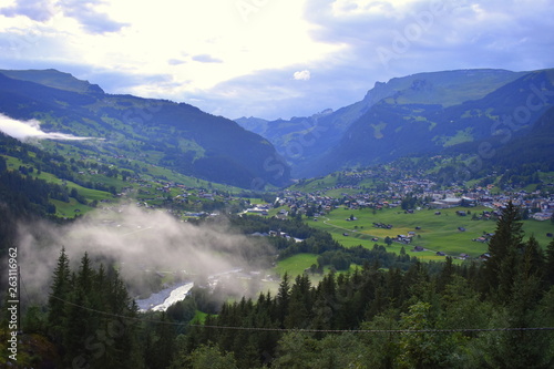 View of Grindelwald from high ground showiıng beautiful village in green nature © keremberk