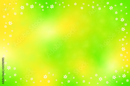 Gelbgrünes Frühlingsbokeh mit kleinen Blumen umrahmt