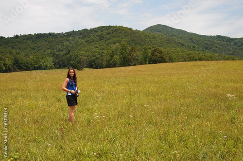 Young woman in Cades Cove in the Great Smoky Mountains National Park, Tennessee, in early summer.
