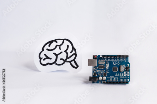 Arduino Uno. Micro controller. Technology. Electronic computing machine. Concept. High intelligence. Brain. The science. White background. photo