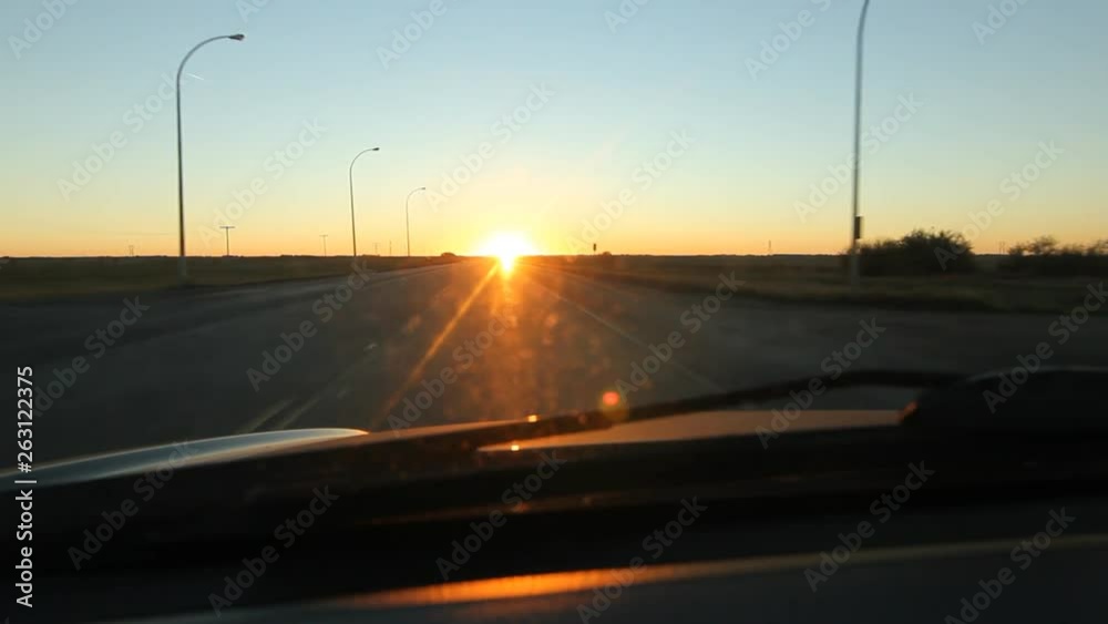 Driving into the morning sun. Dawn drive on Trans Canada HWY 1 in Saskatchewan, Canada. Driving into the morning sun. Dawn drive on Trans Canada HWY 1 in Saskatchewan, Canada.