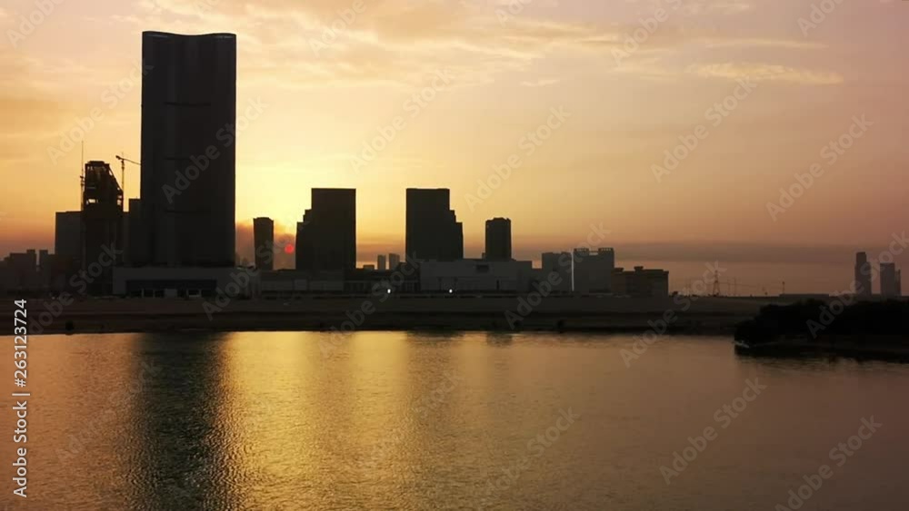 View of modern offices and towers at a clouds sunset - Abu Dhabi, Al Reem Island View of modern offices and towers at a clouds sunset - Abu Dhabi, Al Reem Island