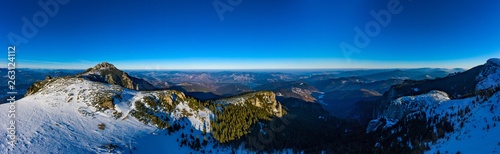 Dochia chalet and Toaca peak at sunrise in Ceahlău Mountains National in winter season,Aerial winter Landscape