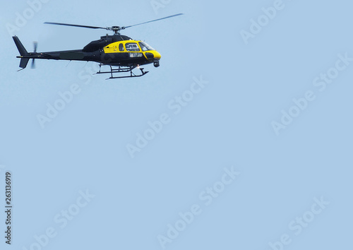 Helicopter Chopper black with blue sky background for editors text copy
