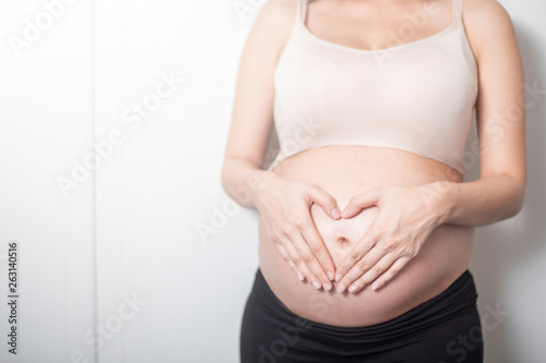 Wallpaper Mural Close up pregnant woman expecting a baby Torontodigital.ca