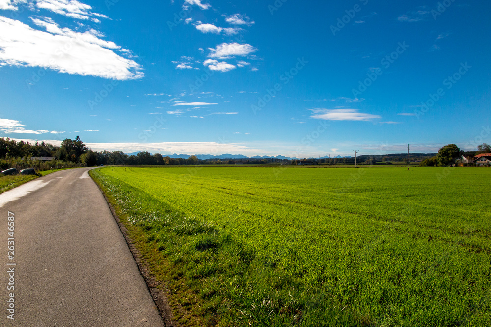 A small regional road passing through the wheat fields in the Landsberg am Lech region of Germany. Via Claudia Augusta A small regional road passing through the wheat fields in the Landsberg am Lech region of Germany. Via Claudia Augusta