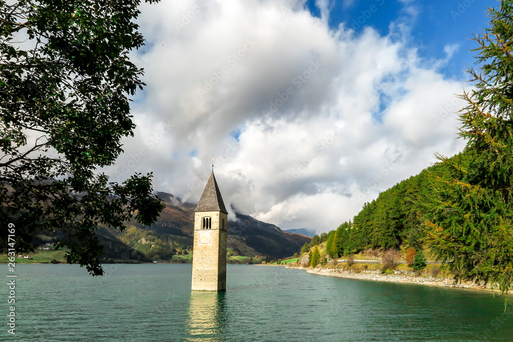Tower of ancient submerged church on the lake di Resia, Italy