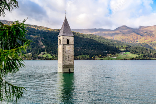 Tower of ancient submerged church on the lake di Resia, Italy