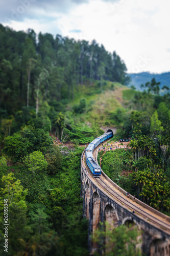 Train on the Nine Arch Bridge in Sri Lanka. Travel to Ceylon island, popular travel  destination in Asia photo