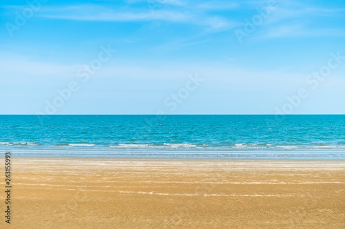 Abstract beach background. Yellow sand, blue sky