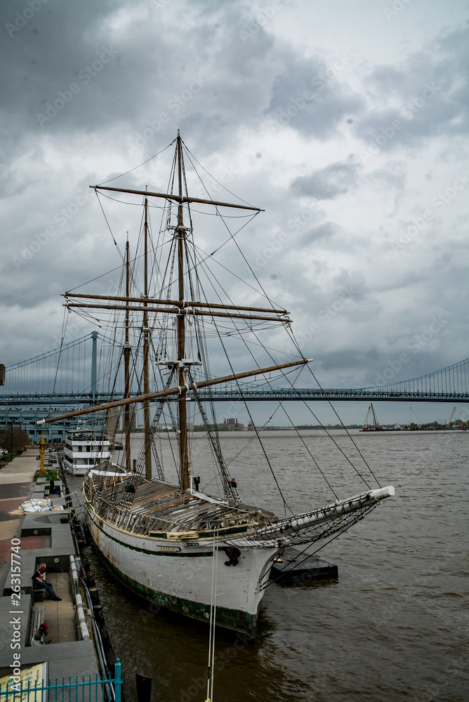 Sailboat in Philadelphia with Benjamin Franklin Bridge in Background Sailboat in Philadelphia with Benjamin Franklin Bridge in Background