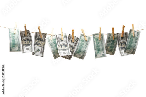 Dollars dry on the clothesline. Isolated on white background.