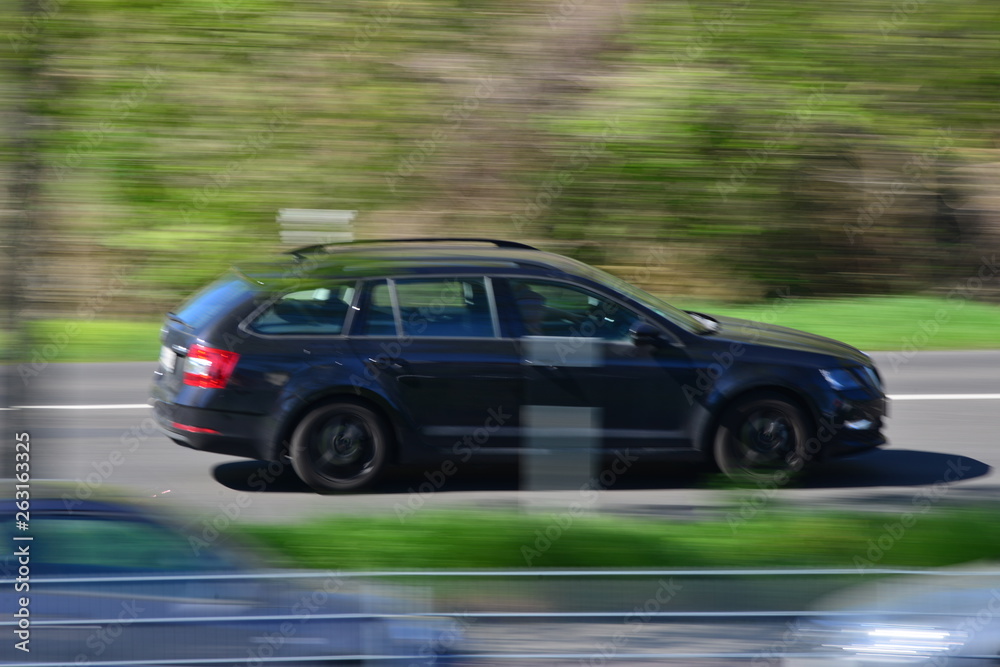 Fototapeta premium european car drivers in their cars on a sunny day with blurred background