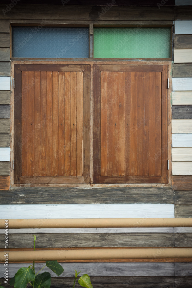 Classic window on red wood wall background. Classic window on red wood wall background.