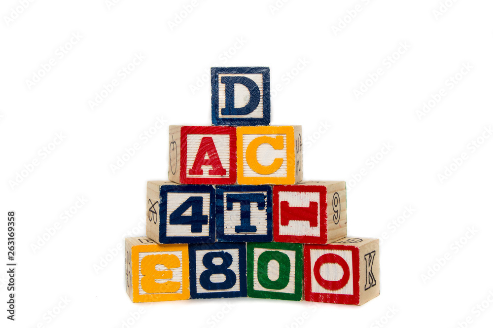 Stacked alphabet blocks on a white background Stacked alphabet blocks on a white background