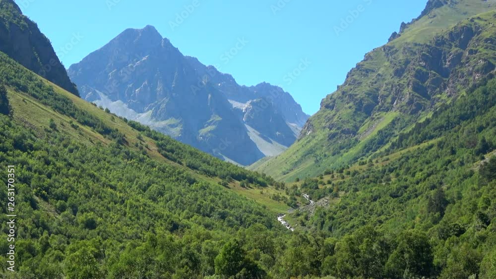 View lake scenes in mountains, national park Dombai, Caucasus, Russia, Europe. Summer landscape, sunshine weather, blue sky and sunny day View lake scenes in mountains, national park Dombai, Caucasus, Russia, Europe. Summer landscape, sunshine weather, blue sky and sunny day