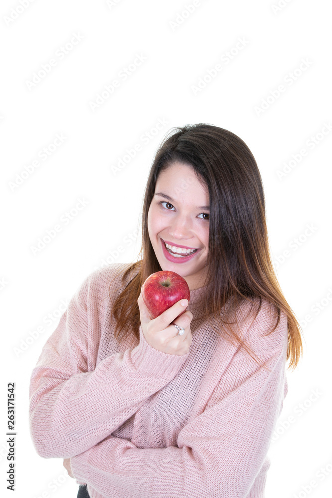 young woman on white background with red apple smiling and laughing young woman on white background with red apple smiling and laughing