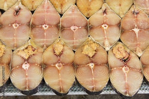 Stack of scomberomorus fish sliced (Cantonese salted fish) at fish market jetty. For seafood, food, kitchen, texture and background.