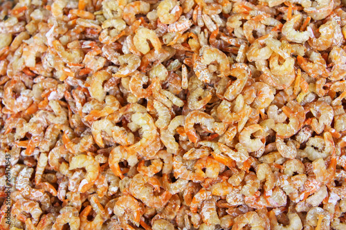 Stack of many dried shrimp on fish market jetty. For seafood, food, kitchen, texture and background.
