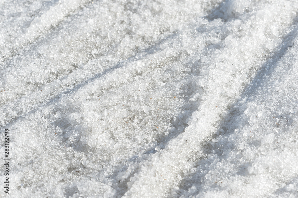 Obraz premium Abstract snow texture. Early spring snow background close up