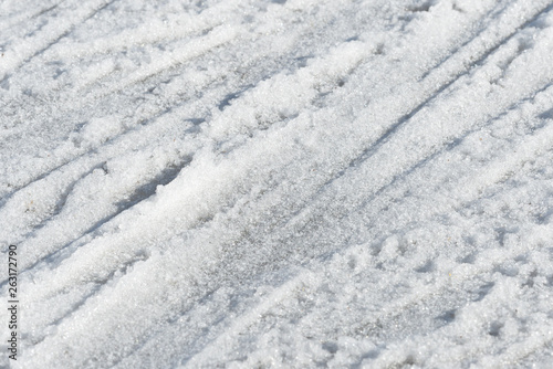 Abstract snow texture. Early spring snow background close up