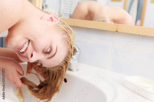Woman having wet blonde hair